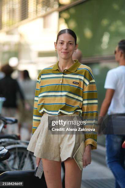 Guest wearing shorts, Miu Miu shirt is seen outside Giorgio Armani during the Milan Fashion Week Menswear Spring/Summer 2025 on June 17, 2024 in...
