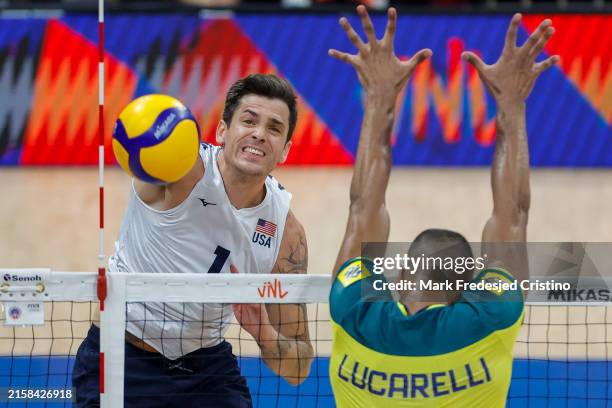 Matthew Anderson of USA spikes the ball during the FIVB Men's Nations League game between Brazil and USA at SM Mall of Asia Arena on June 20, 2024 in...