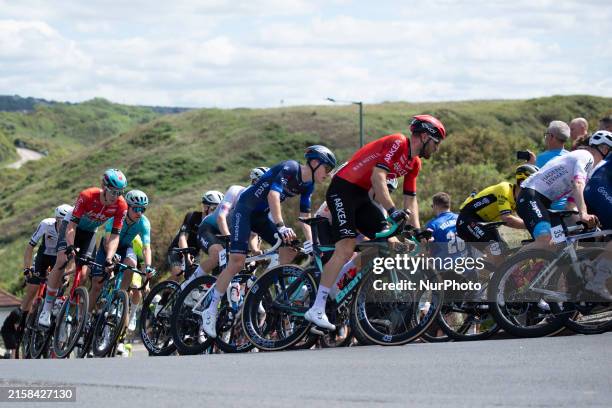 Male peloton riders are powering up Saltburn Bank during the British National Road Cycling Championships in Saltburn by the Sea, Cleveland, England,...