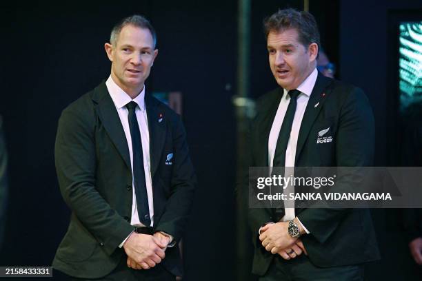 New Zealand rugby assistant coach Leon MacDonald talks with New Zealand Rugby CEO Mark Robinson during the team's Test squad announcement at the Te...