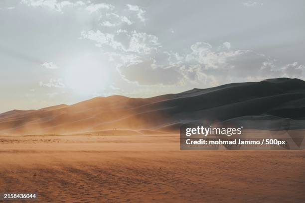 scenic view of desert against sky - paisagem árida imagens e fotografias de stock