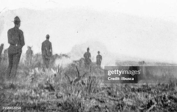 antique photograph of cuba during the spanish american war, first shot from second cannon upon san juan from el poso hill - battle of san juan hill stock illustrations