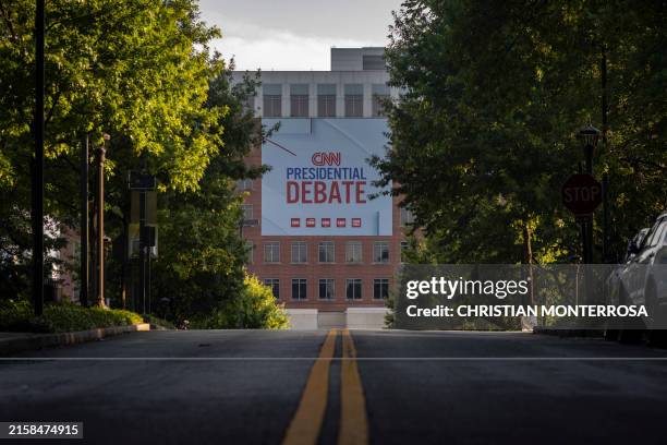 Banners are placed outside of CNN studios ahead of the first presidential debate in Atlanta, Georgia on June 24, 2024. Two years after the US Supreme...