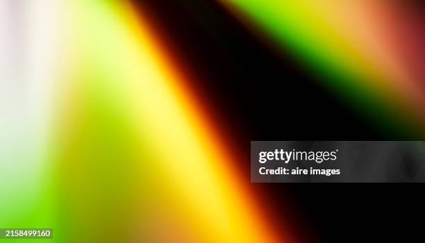 abstract light leak with green, yellow, orange, and red colors - high key photos et images de collection