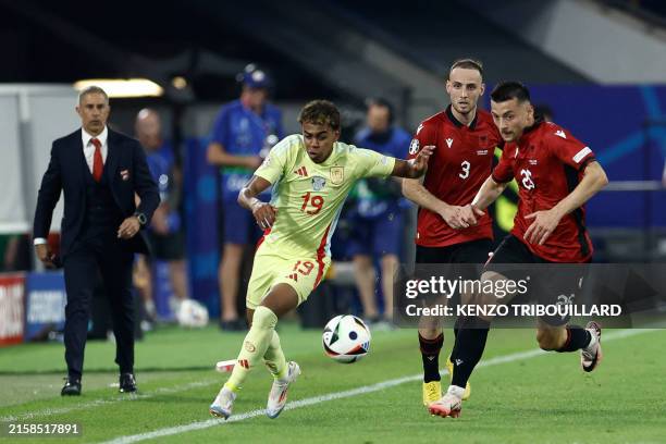 Spain's forward Lamine Yamal is marked by Albania's forward Arber Hoxha during the UEFA Euro 2024 Group B football match between Albania and Spain at...