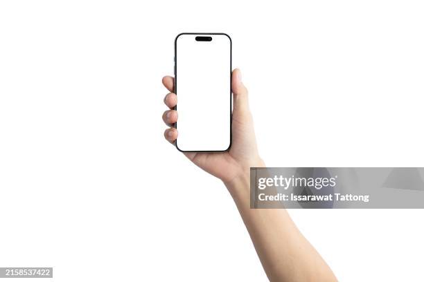 a hand holding a white cell phone - teléfono inteligente fotografías e imágenes de stock