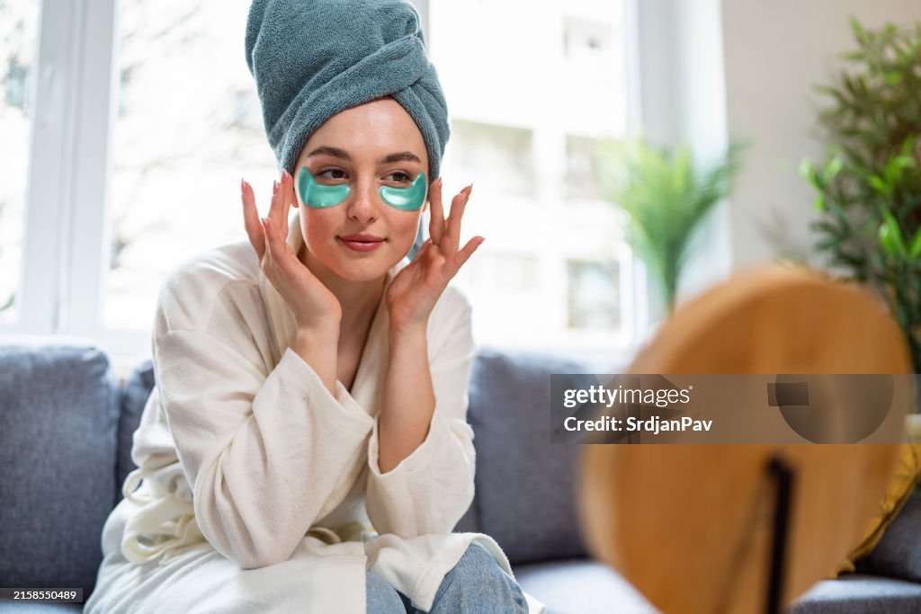 Young woman doing her beauty routine at home