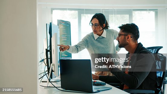 Collaborative Latinx Programmers Discussing Code on Monitor, Remote and Hybrid Work, Artificial Intelligence and Machine Learning Collaborative Latinx Programmers Discussing Code on Monitor, Remote and Hybrid Work, Artificial Intelligence and Machine Learning