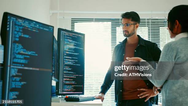 hispanic coworker developers reviewing code together - database administrator stock pictures, royalty-free photos & images