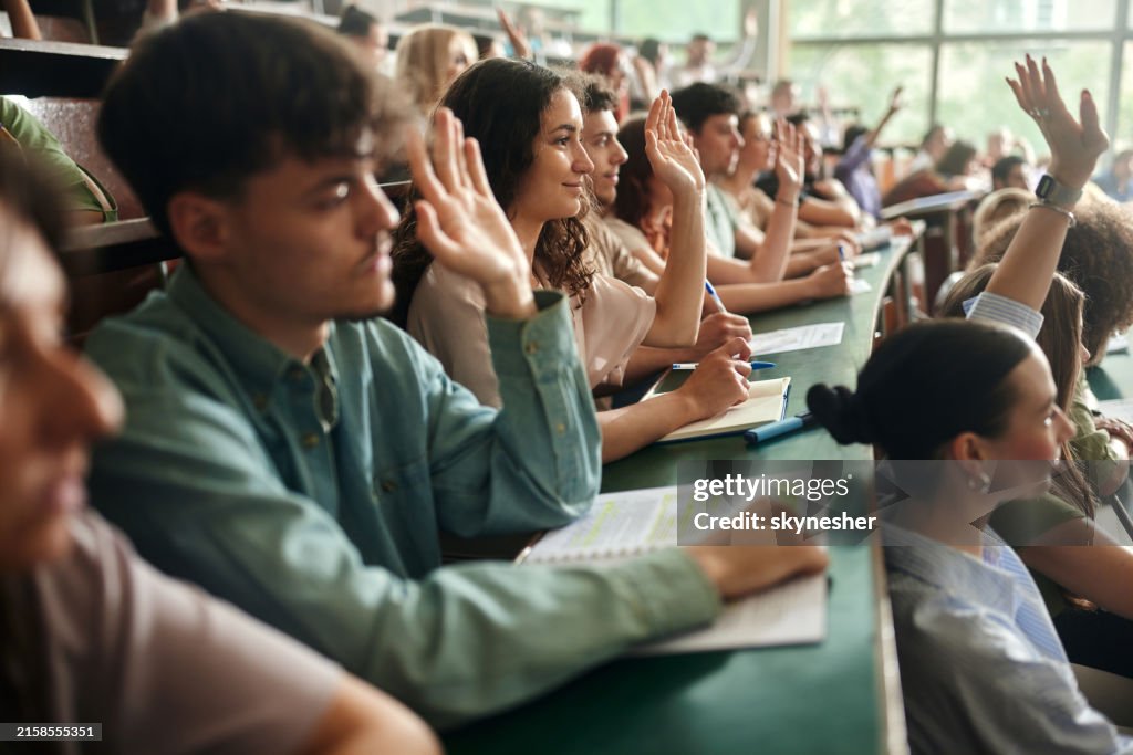 People Rasing Their Hand For Questions College Students Raising Their Hands On A Class At Lecture Hall High ...