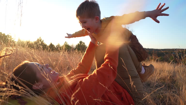 https://media.gettyimages.com/id/2158562357/video/adorable-little-boy-from-below-having-fun-pretending-to-fly-like-a-superhero-with-arms.jpg?b=1&s=640x640&k=20&c=TLD-GZFW6Ymggl5kzGxnnPUA4TbaidvhtuaUNwfqhQw=