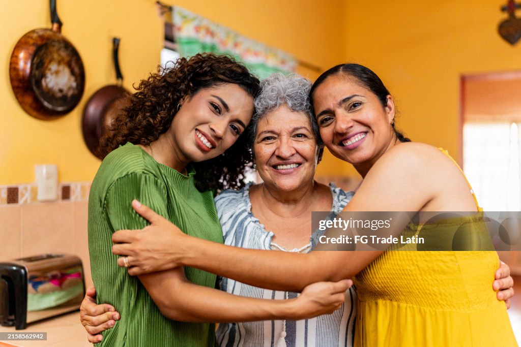Portrait of family embraced at home