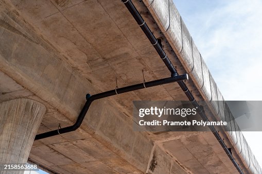 Pvc Bridge Line Close Up Of Drain Pipes Under A Highway Bridge Black Plastic Pipes Are ...