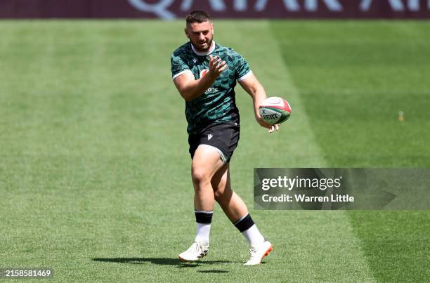 Gareth Thomas of Wales passes the ball during the Wales Captain's Run at Twickenham Stadium on June 21, 2024 in London, England.