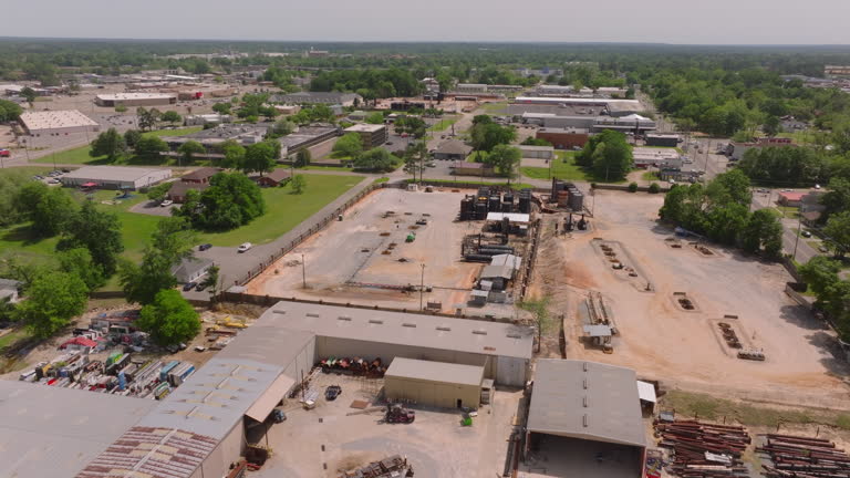 https://media.gettyimages.com/id/2158591240/video/aerial-view-of-a-lumber-yard-in-a-small-town-in-the-usa-workers-operate-machinery-in-a.jpg?b=1&s=640x640&k=20&c=C1HVAAJvrnr5MCPlTT5sq1kprjwTNon5N4madguPeUU=