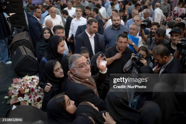 The Mayor of Tehran and Iran's 2024 early presidential elections candidate, Alireza Zakani, is waving to the camera while attending an electoral...