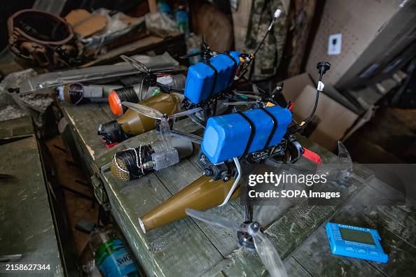 Fpv Incendiary FPV drones with explosives attached to them are seen inside a bunker ...