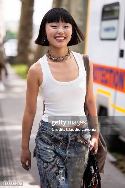 Lin Lin Yujing wears white tank top, decorated jeans, outside Rick Owens, during the Haute Menswear Spring/Summer 2025 as part of Paris Fashion Week...