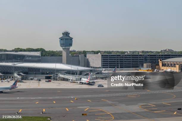 American Airlines and American Eagle aircraft docked at the airport terminal of LaGuardia. General view of the LaGuardia Airport LGA with the...