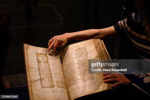 Sharon Mintz , Sotheby's senior Judaica specialist for books and manuscripts, flips through and points to part of "The Shem Tov Hebrew Bible: A...