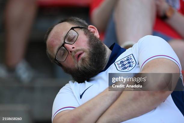 Fans of England and Slovenia wearing face paints support their teams ahead of UEFA EURO 2024 Group C match between England and Slovenia at Cologne...