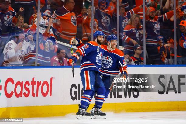 Adam Henrique and Dylan Holloway of the Edmonton Oilers celebrate after Henrique's goal during the second period of Game Six of the 2024 Stanley Cup...