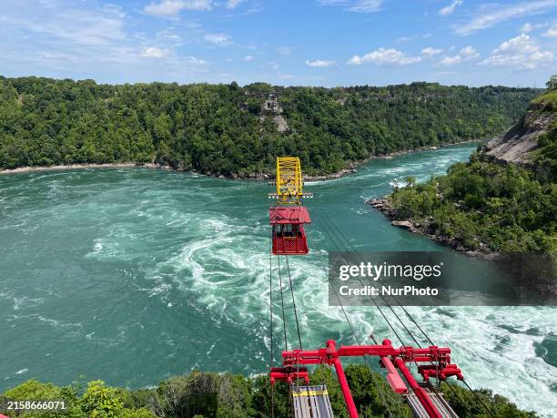 The Whirlpool Aero Car in Niagara Falls, Ontario, Canada, on June 12 is transporting passengers over a section of the Niagara River referred to as...