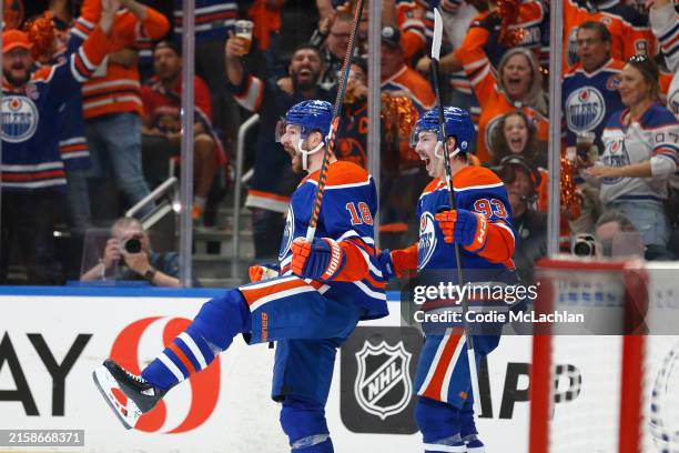Zach Hyman and Ryan Nugent-Hopkins of the Edmonton Oilers celebrate after Hyman's goal against the Florida Panthers during the second period of Game...