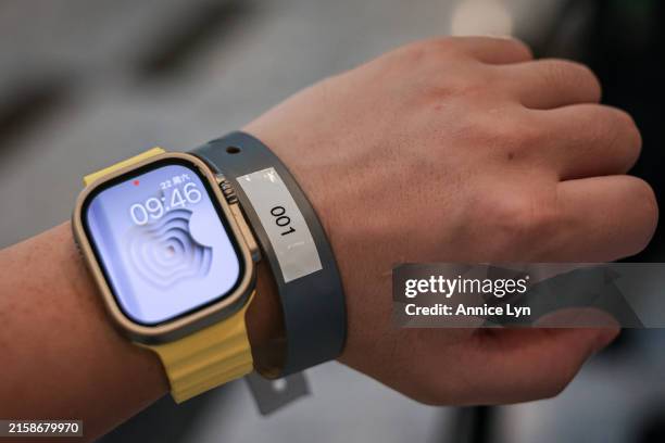 Chen from Xi’an, China, is the first customer lined up outside the new Apple store at the Tun Razak Exchange on June 22 in Kuala Lumpur, Malaysia....