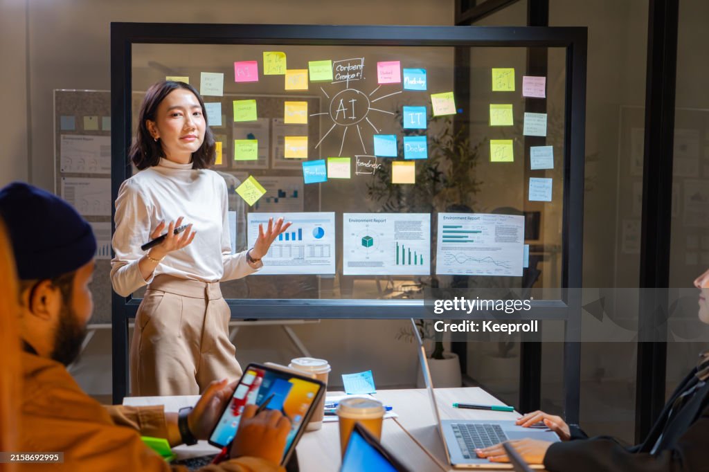 Asian businesswoman presenting business plan in meeting room