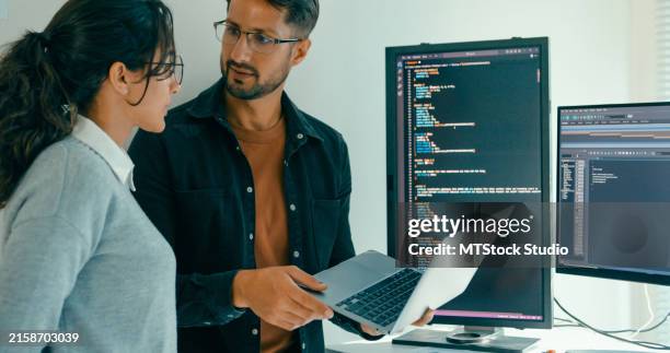 software engineering team engaged in problem-solving and code analysis for web development in modern office. software developer, artificial intelligence and programming. - application programming interface stockfoto's en -beelden