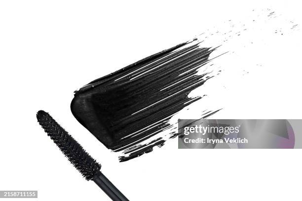 black smear mascara on white background, isolated. cosmetic make-up products for eyelashes. - pinceau à maquillage photos et images de collection