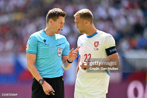 Referee Daniel Siebert speaks with Tomas Soucek of Czechia during the UEFA EURO 2024 group stage match between Georgia and Czechia at...