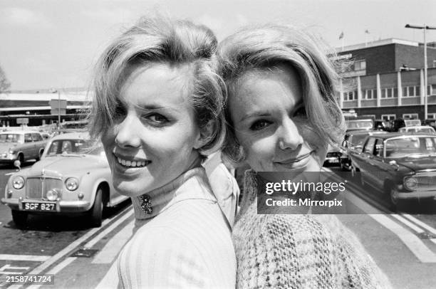 Twins, Ellen and Alison Kessler at Heathrow airport, one has come from Paris, the other from Munich. They are here for the Rolf Harris television...
