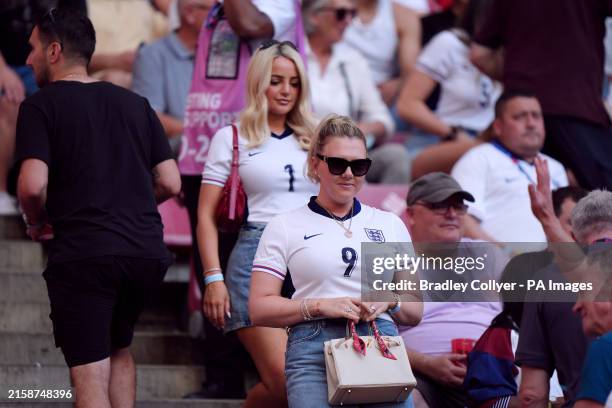 Katie Goodland, wife of England's Harry Kane and Megan Davison , wife of England goalkeeper Jordan Pickford during the UEFA Euro 2024 Group C match...