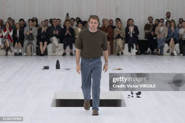 Fashion designer Jonathan Anderson walks the runway during the Loewe Ready to Wear Spring/Summer 2025 fashion show as part of the Paris Men Fashion...