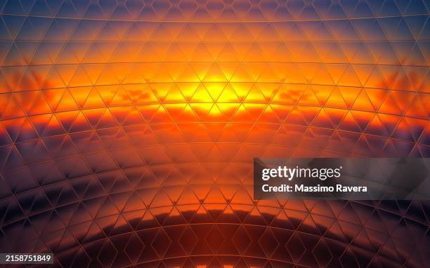 metallic surface reflecting sunset light. - effetto luminoso foto e immagini stock