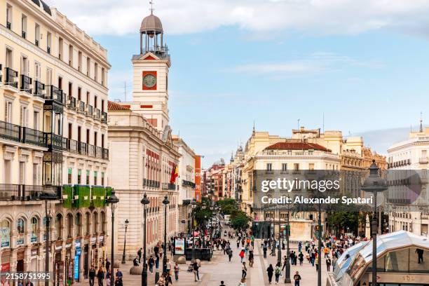 puerta del sol city square with real casa de correos clock tower, madrid, spain - madrid stockfoto's en -beelden