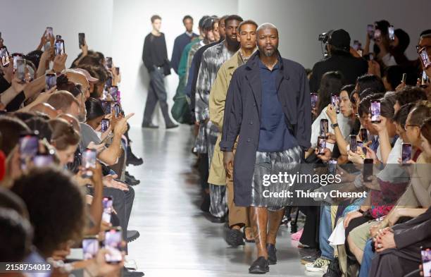 Former French soccer Djibril Cisse walks the runway at the end of the White Mountaineering Menswear Spring/Summer 2025 show as part of Paris Fashion...