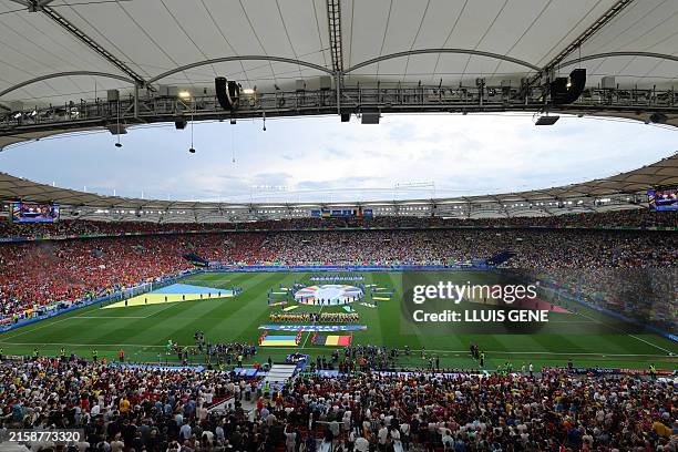 Players arrive on the pitch for the UEFA Euro 2024 Group E football match between Ukraine and Belgium at the Stuttgart Arena in Stuttgart on June 26,...