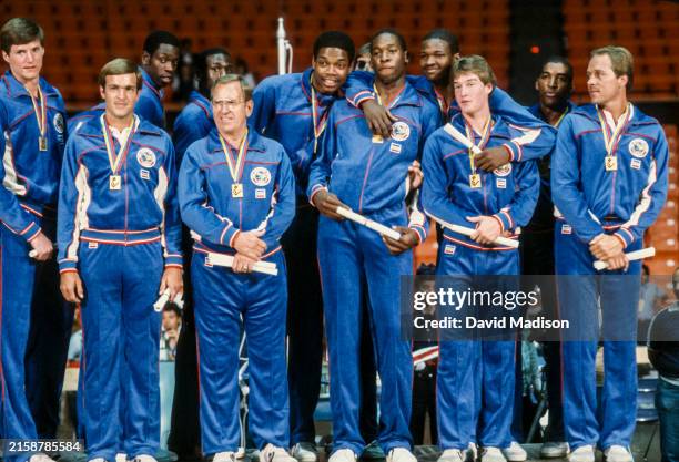 The USA Men's Basketball Team gathers on the awards stand after receiving their gold medals for winning the 1983 Pan Am Games basketball tournament...