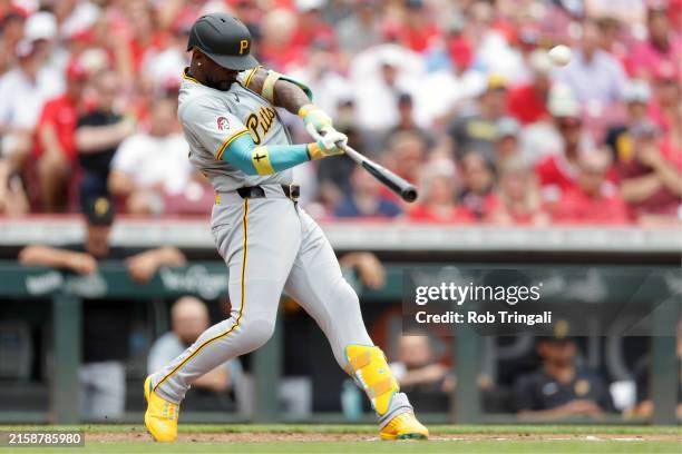 Andrew McCutchen of the Pittsburgh Pirates hits a two-run home run in the fifth during the game between the Pittsburgh Pirates and the Cincinnati...