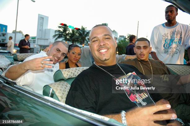 Rapper Pitbull , guest, DJ Laz , guest, and film director Flyy Kai on the set of "Dammit Man" at Club Deep in Miami Beach, Florida on September 20,...