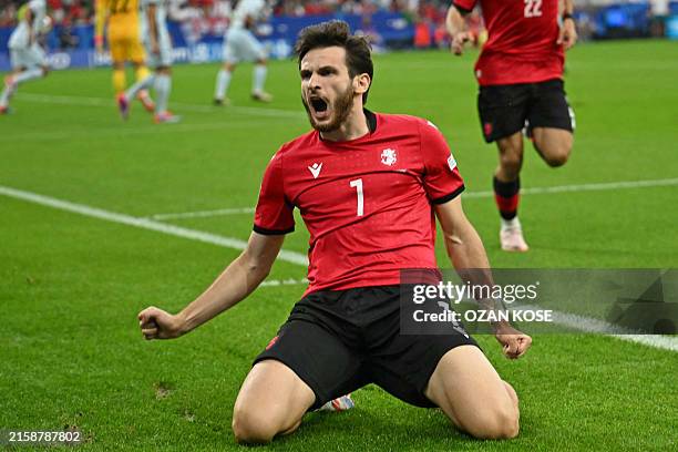 Georgia's forward Khvicha Kvaratskhelia celebrates scoring his team's first goal during the UEFA Euro 2024 Group F football match between Georgia and...