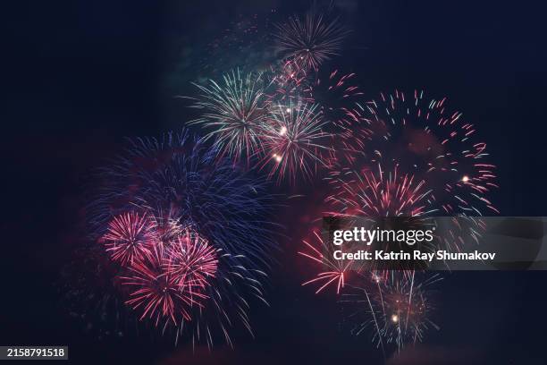 fantastic fireworks in deep blue skies - raket bildbanksfoton och bilder