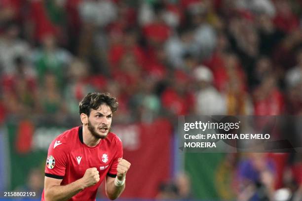 Georgia's forward Khvicha Kvaratskhelia celebrates his team's second goal during the UEFA Euro 2024 Group F football match between Georgia and...