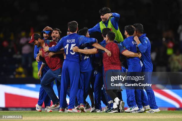 Afghanistan players celebrate winning the ICC Men's T20 Cricket World Cup West Indies & USA 2024 Super Eight match between Afghanistan and Australia...