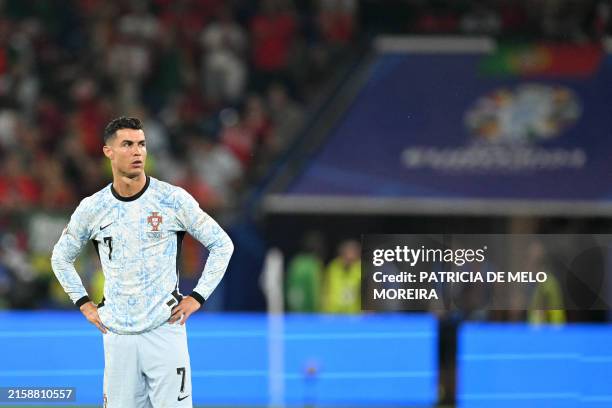 Portugal's forward Cristiano Ronaldo reacts after he lost the UEFA Euro 2024 Group F football match between Georgia and Portugal at the Arena...