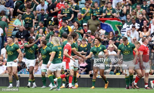 Jordan Hendrikse of South Africa is congratulated by Eben Etzebeth of South Africa after scoring a try during the Summer Rugby International between...