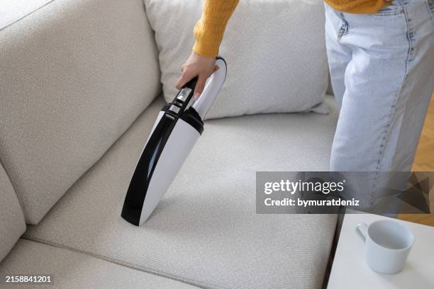 vacuum cleaner for cleaning the sofa in the house - vacuum cleaner stock pictures, royalty-free photos & images